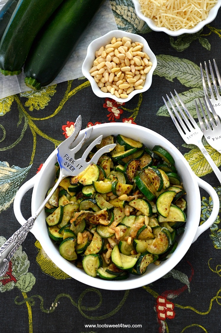 Zucchini cut into moons sauteed with Parmesan and pine nuts - one of the best zucchini recipes.
