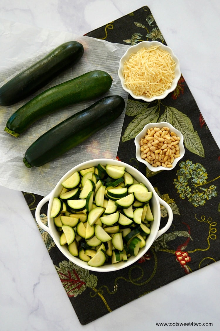 Zucchini cut into "moons" with Parmesan and pine nuts.