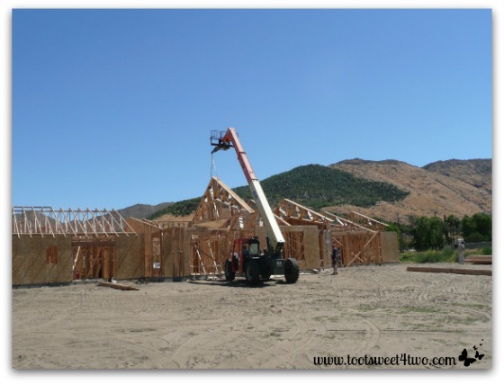 Hoisting the roof trusses into place.