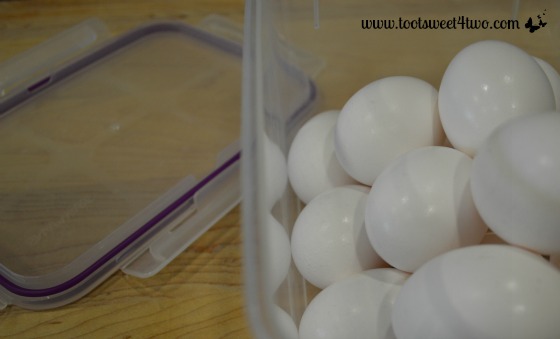 Hard-boiled eggs in plastic container.