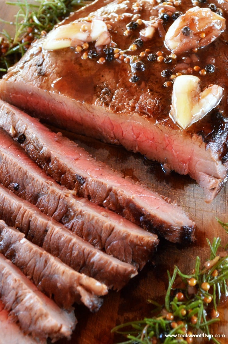 Want to make the perfect London broil? Then you need to do two things - marinate it for several hours and grill it! This simple and easy recipe for Grilled London Broil is not something you can make at the last minute. Because London Broil, aka flank steak, is a tougher cut of meat, the key to this flavorful, delicious, juicy and tender main course is marinating it for 4 to 6 hours. | www.tootsweet4two.com