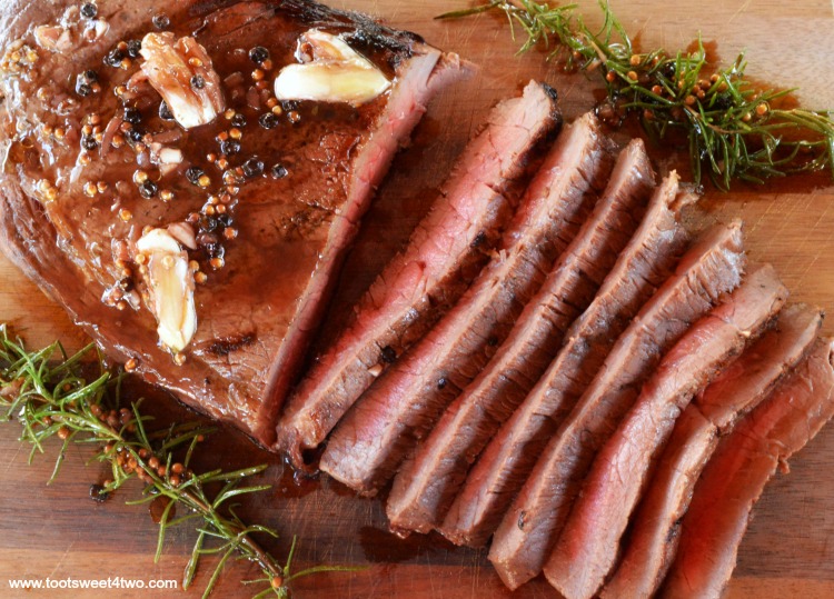 Want to make the perfect London broil? Then you need to do two things - marinate it for several hours and grill it! This simple and easy recipe for Grilled London Broil is not something you can make at the last minute. Because London Broil, aka flank steak, is a tougher cut of meat, the key to this flavorful, delicious, juicy and tender main course is marinating it for 4 to 6 hours. | www.tootsweet4two.com