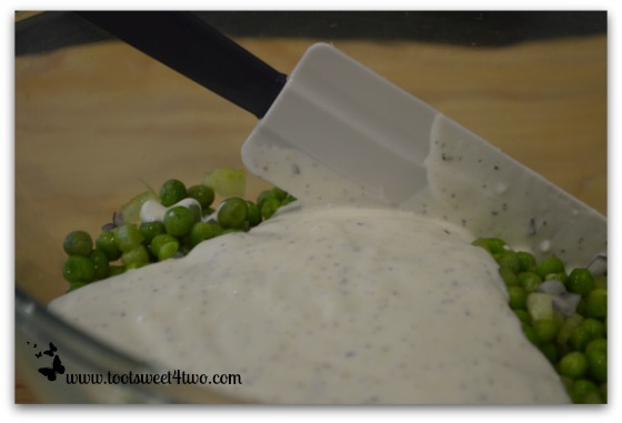 Mix dressing with peas