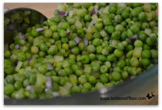 Petite peas mixed with celery and red onion