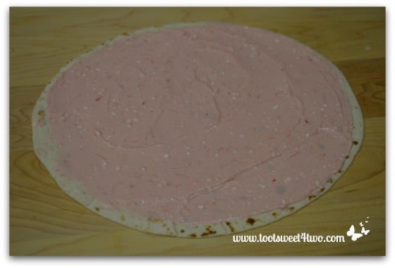 Strawberry cream cheese on flour tortilla