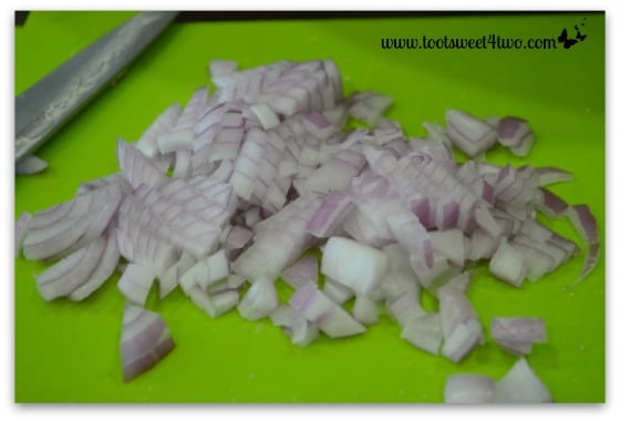 Chopped red onion for Tri-Colored Roasted Potato Salad