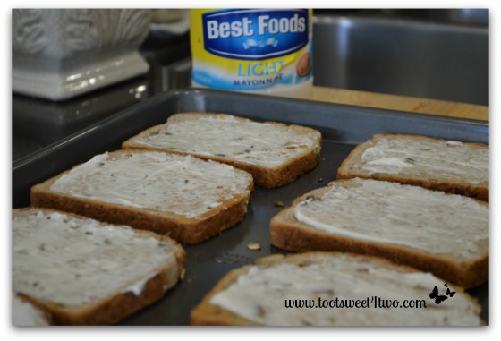 Light mayonnaise on toast for Chicken and Arugula Open-faced Sandwiches