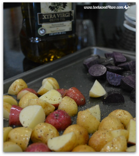 Olive oil, salt and pepper on potatoes for Tri-Colored Potato Salad