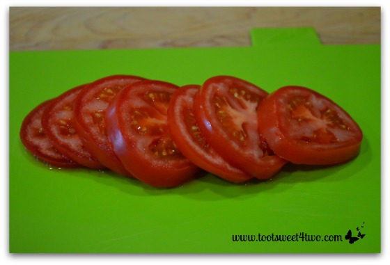 Sliced tomatoes for Caprese Roll-ups