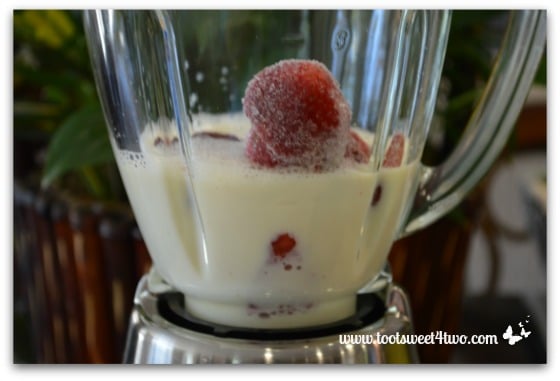 Soy milk with frozen strawberries in blender - Strawberry Protein Smoothie
