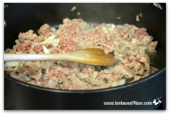 Add onions to ground turkey - Charlie's Lite Layered Mexican Casserole