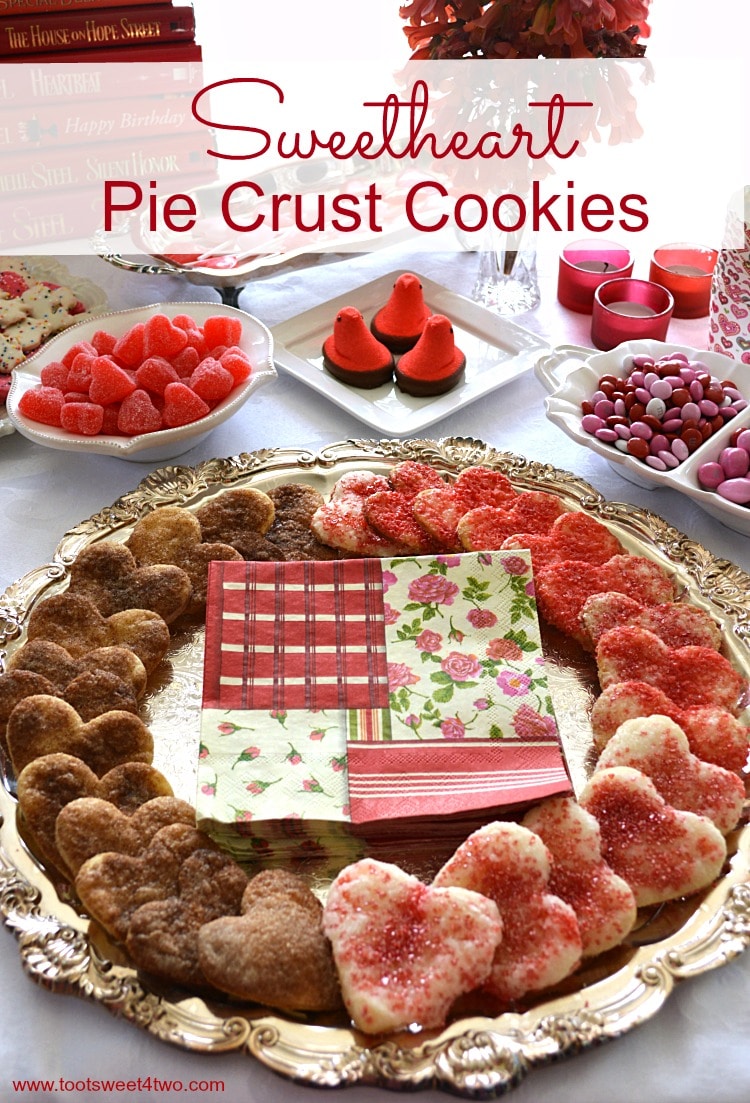 Heart-shaped pie crust cookies on a silver platter.