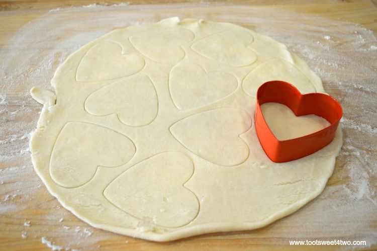 Store-bought pie crust and heart-shaped cookie cutter for Sweetheart Pie Crust Cookies.