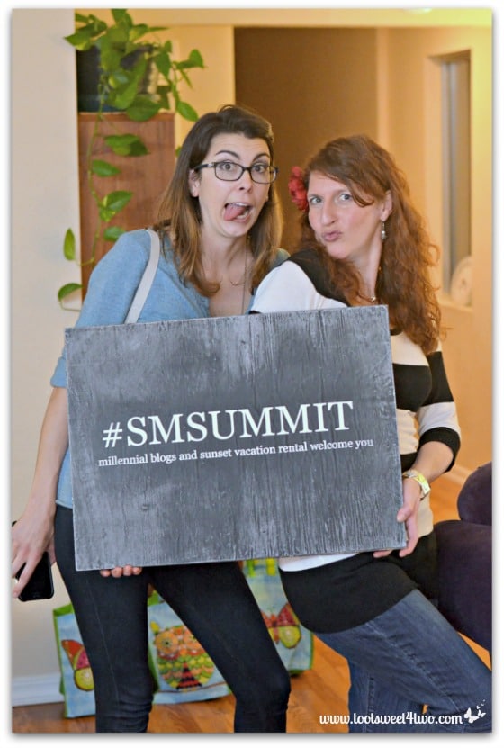 Chelsea and Amy holding the SMSummit sign - 17 girls and a baby