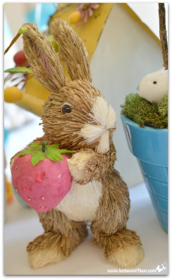 Straw Bunny holding strawberry - Decorating the Table for an Easter Celebration