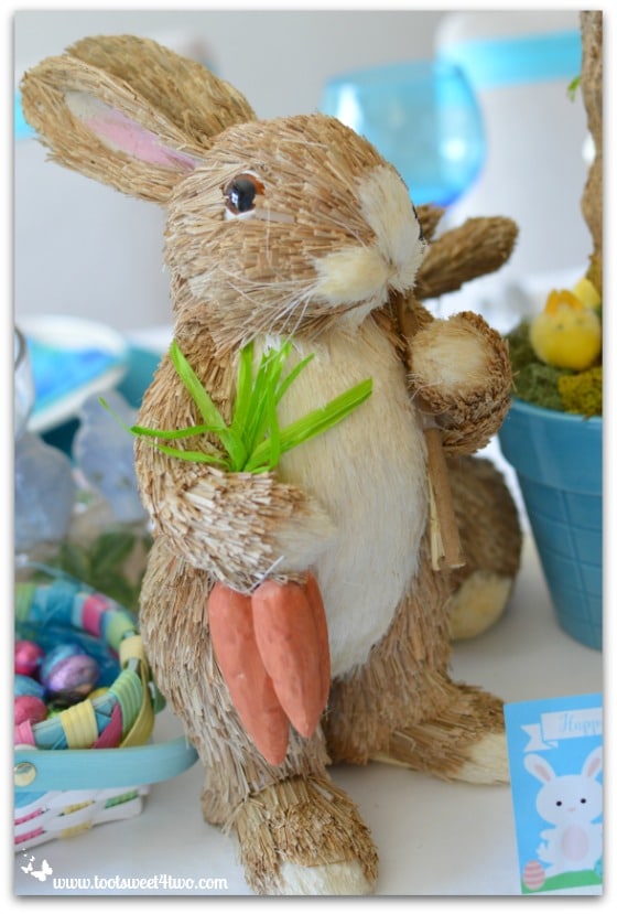 Straw Bunny with carrots and shovel - Decorating the Table for an Easter Celebration