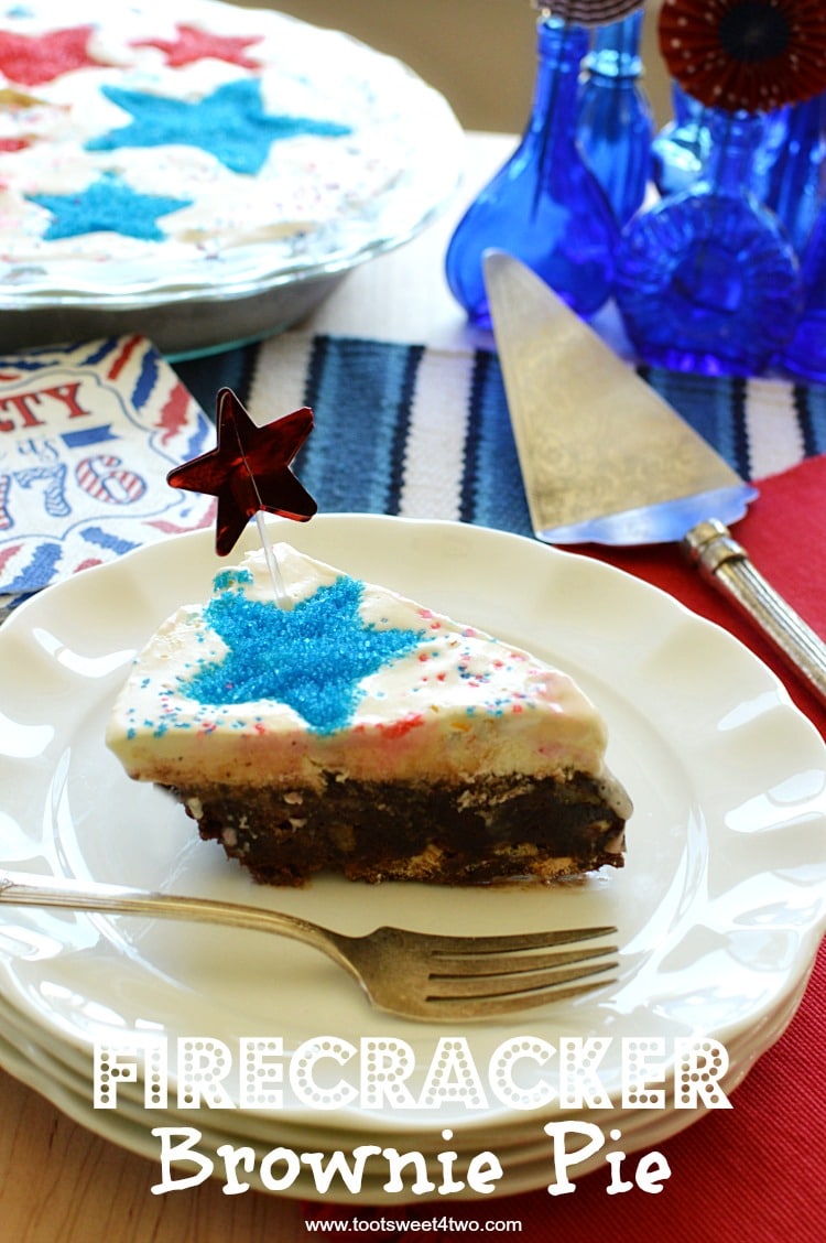Firecracker Brownie Pie - a fun and festive 4th of July brownie recipe made with store-bough chocolate fudge brownie mix. Jarred hot fudge topping, vanilla ice cream and a surprise ingredient make this easy Independence Day dessert worthy of any Patriotic party celebration! Add sparkly red and blue stars by using various size star-shaped cookie cutters! | www.tootsweet4two.com