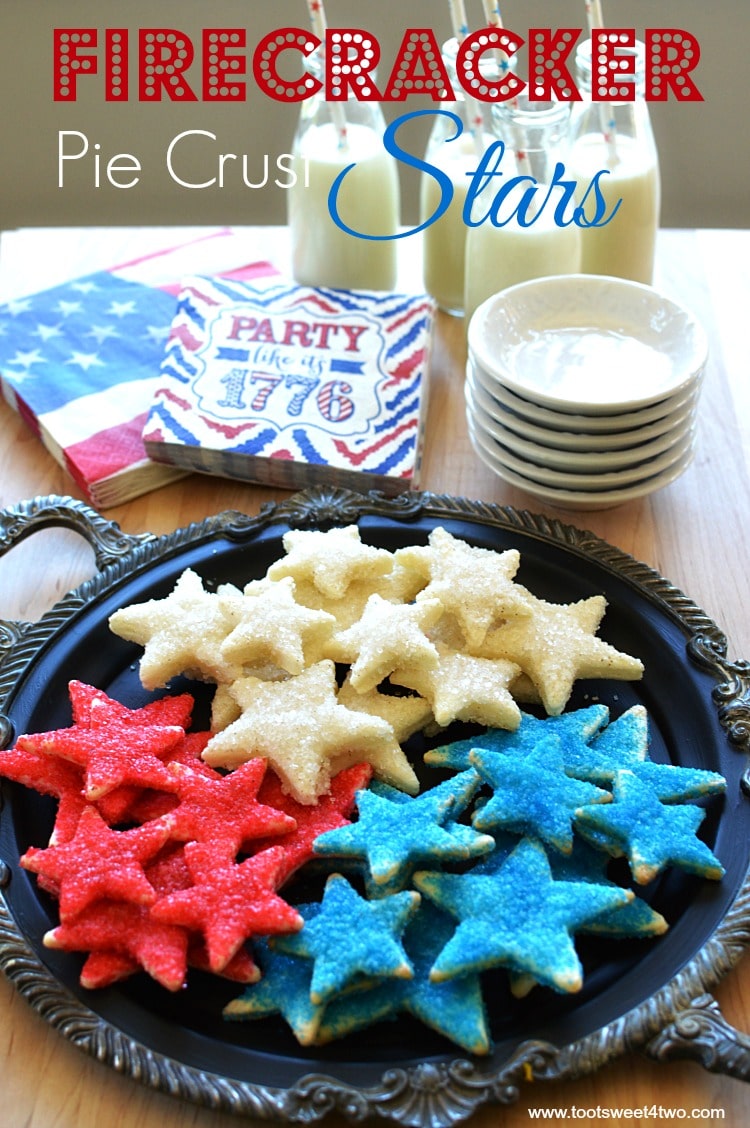 Firecracker Pie Crust Stars - made with store-bought pre-made pie crust dough cut-out with various star-shaped cookie cutters, slathered with butter then liberally sprinkled with colored sugar and baked, these cookies are the perfect sweet/salty combo that's so addicting! Get this easy and festive 4th of July Patriotic party recipe at www.tootsweet4two.com.