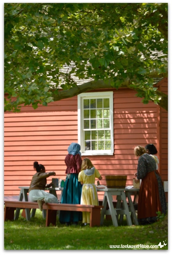 Pioneer women and girls in front of School House at Genesee Country Village