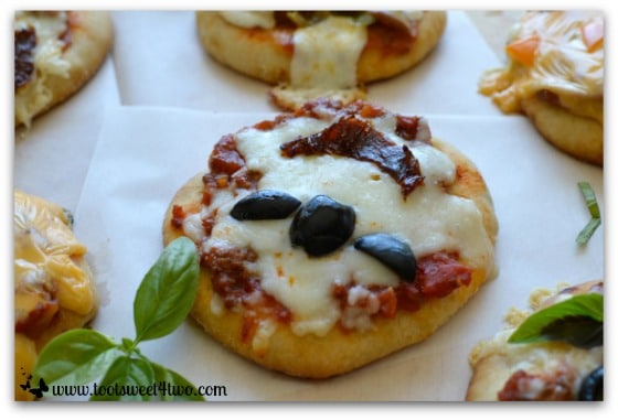 Bat Under a Blood Red Moon Pizza baked - Fright Night Mini Pizzas