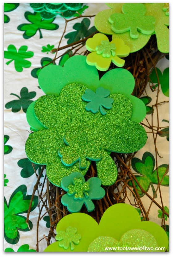 Close-up of shamrocks placed on grapevine wreath