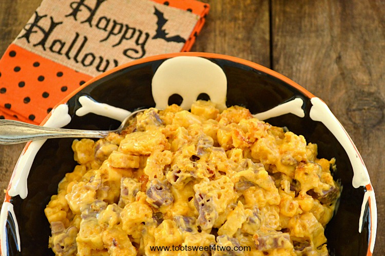 Cheesy Brown Butter Halloween Mac & Cheese in Skeleton serving bowl close-up