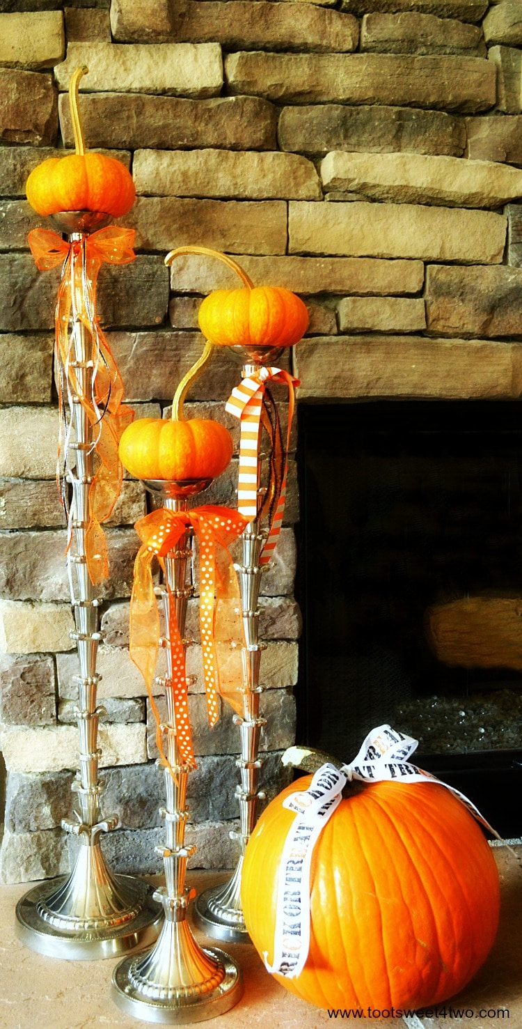 Jack-Be-Little pumpkins and Howden pumpkin on the fireplace hearth