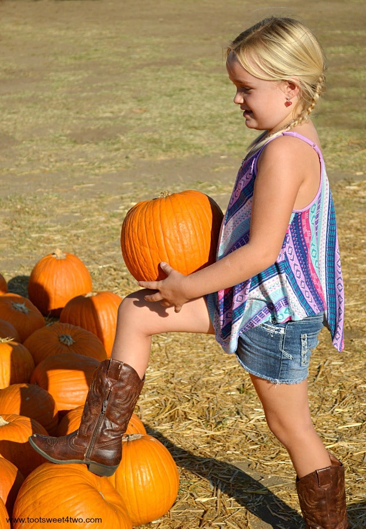 Princess Sweetie Pie balancing a pumpkin on her knee 2015