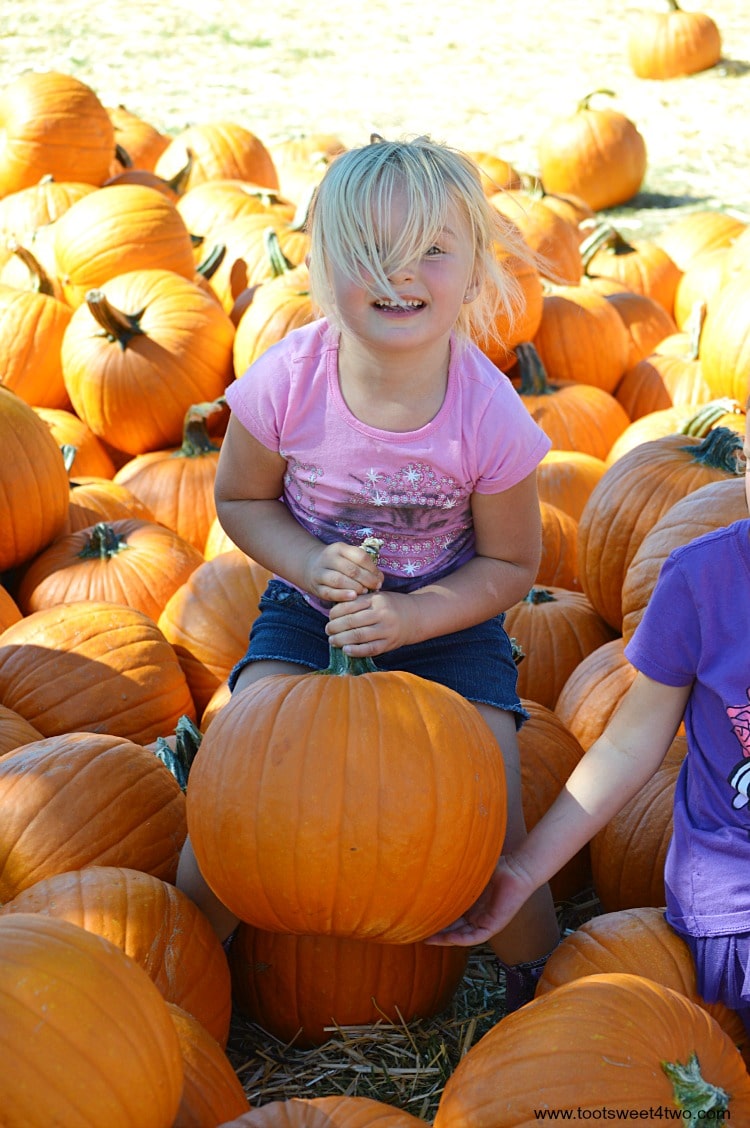 Princess Sweetie Pie hoisting a pumpkin with a helping hand