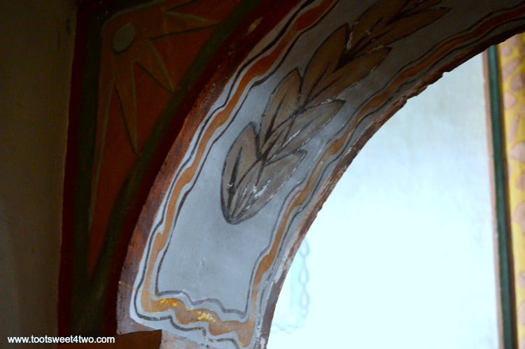 Arched fresco doorway inside Mission San Luis Rey Church