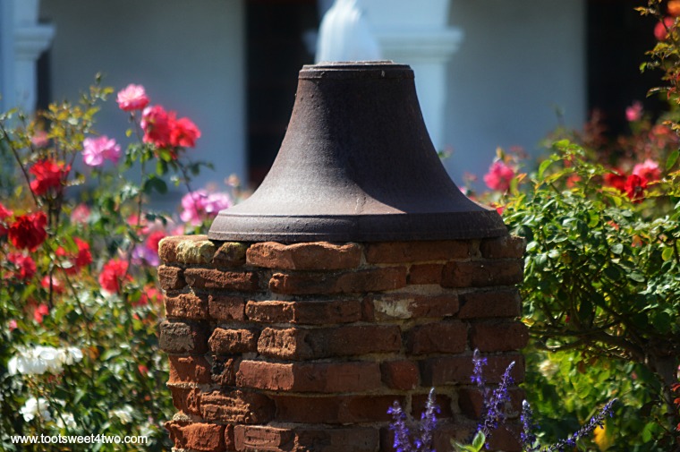 Mission Bell on brick column at Mission San Luis Rey
