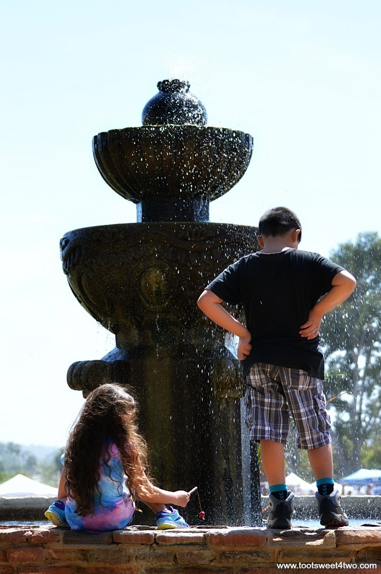 Children on the fountain at Old Mission San Luis Rey Gardens