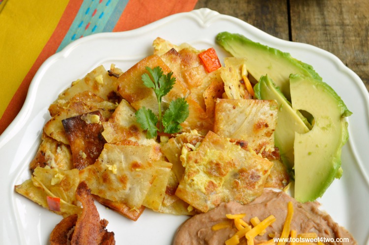 Need a special recipe for Sunday brunch? Huevos con Tortillas satisfies both your breakfast cravings and your Mexican food cravings all at once! Flour tortillas are cut into strips then fried in bacon grease (decadent, for sure!). Scramble the chips with the eggs, then serve this delicious dish with a side of bacon and refried beans. Crunchy eggs = scrumptious! Yum!