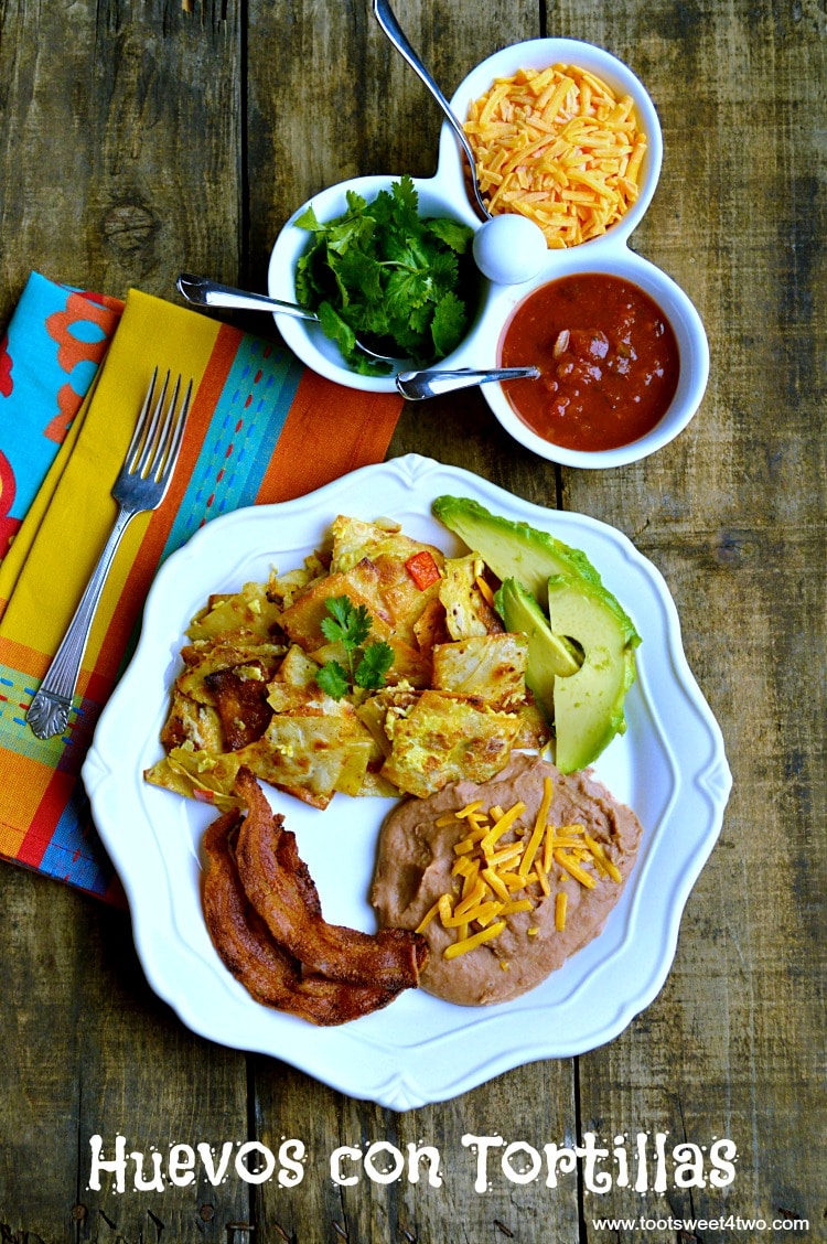 Need a special recipe for Sunday brunch? Huevos con Tortillas satisfies both your breakfast cravings and your Mexican food cravings all at once! Flour tortillas are cut into strips then fried in bacon grease (decadent, for sure!). Scramble the chips with the eggs, then serve this delicious dish with a side of bacon and refried beans. Crunchy eggs = scrumptious! Yum!