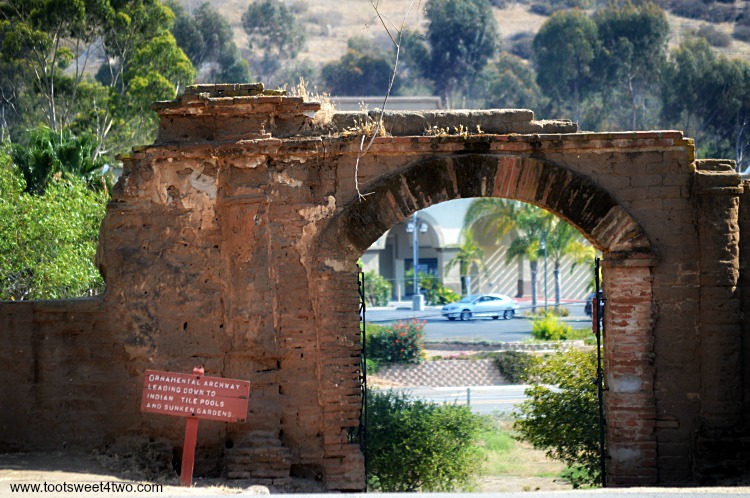 Lavanderia archway at Mission San Luis Rey overlooking a road
