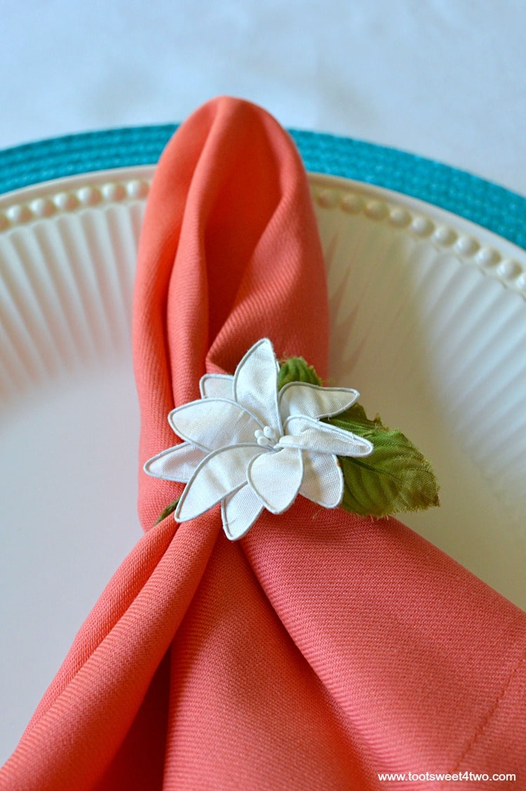 Peach napkins and blue placemat for Decorating the Table for a Cinco de Mayo Celebration