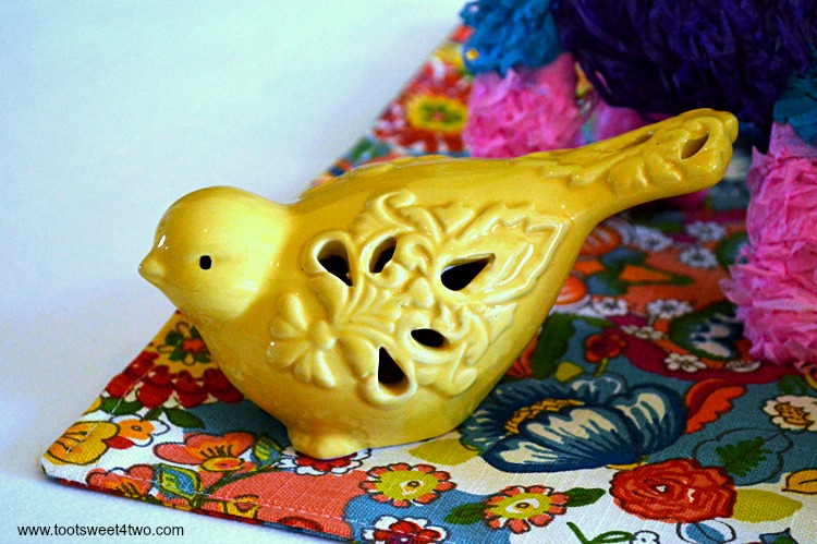 Yellow ceramic bird for Decorating the Table for a Cinco de Mayo Celebration
