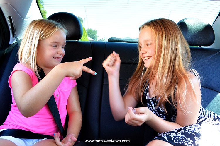 Playing Rock, Paper, Scissors in the car