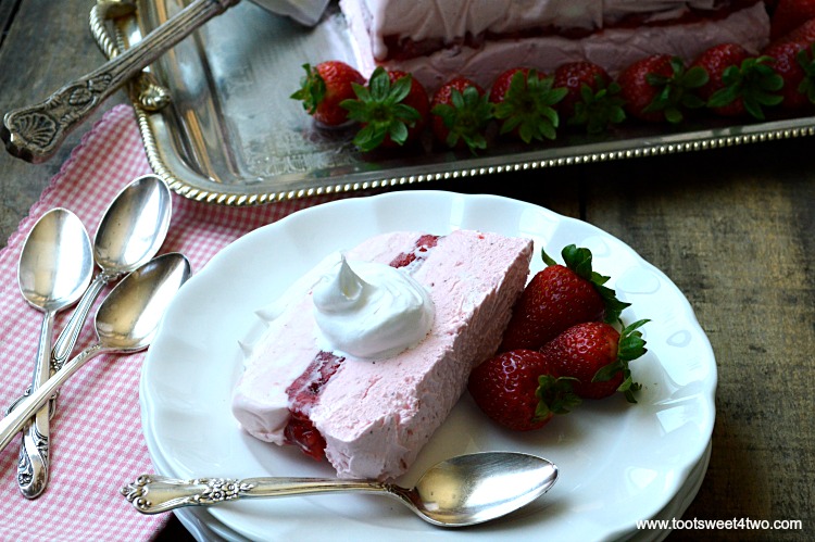 Looking for unique cheesecake recipes? Look no further! Strawberry Icebox Cheesecake is an easy, frozen, no bake strawberry cheesecake dessert that combines an easy-to-make strawberry cheesecake layer with a layer of strawberry cheesecake ice cream. Frozen for hours or overnight, unmold this luscious concoction onto a pretty platter, dollop with Cool Whip and then top with fresh strawberries. A spectacular-looking dessert, this delicious recipe will "wow" friends and family. | www.tootsweet4two.com