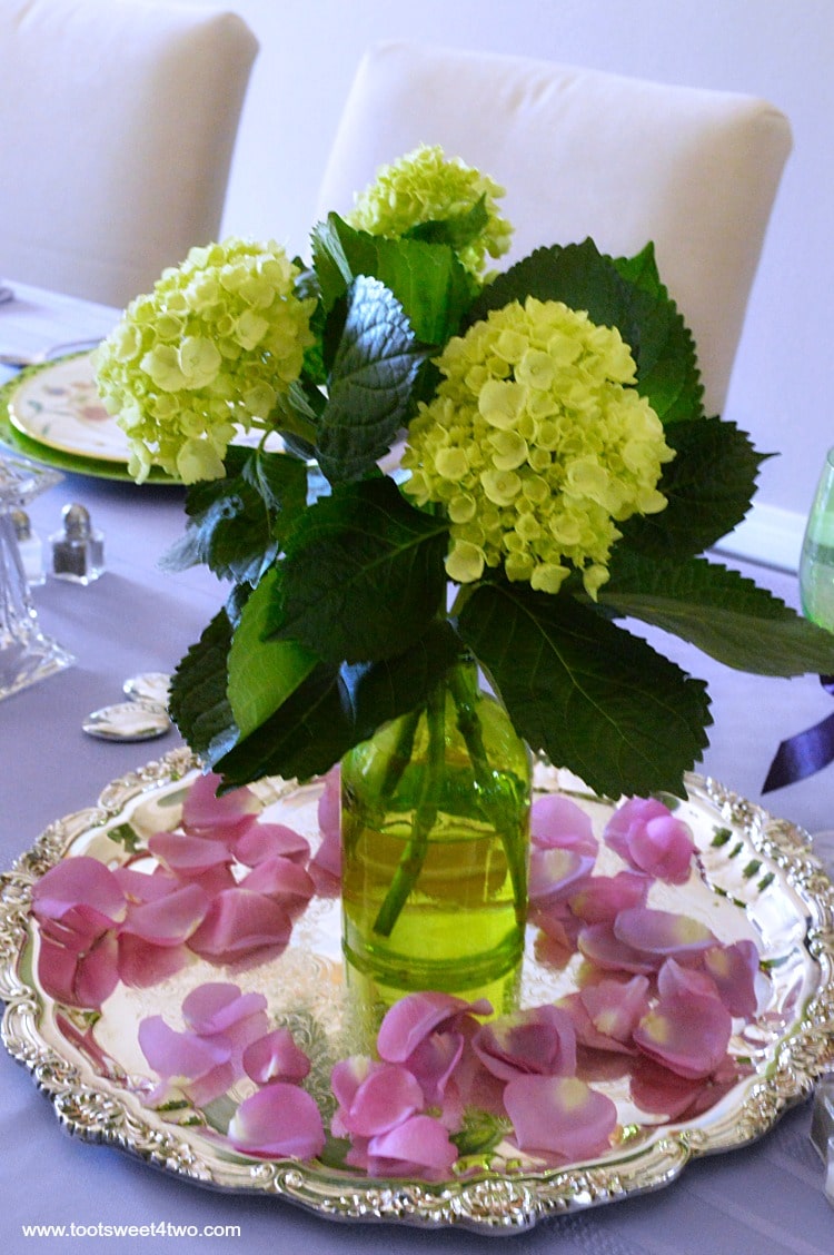 Take a walk on the unconventional side and decorate your dining table in unexpected colors! These dining table decor ideas for a purple and green tablescape are a fun way to decorate a table for a special party. Whether you are decorating a table for a party by choosing a school team color combo, sports team colors, corporate business colors or the favorite colors of the guest of honor, wow your guests with unusual table decorations with these tips and ideas. | www.tootsweet4two.com