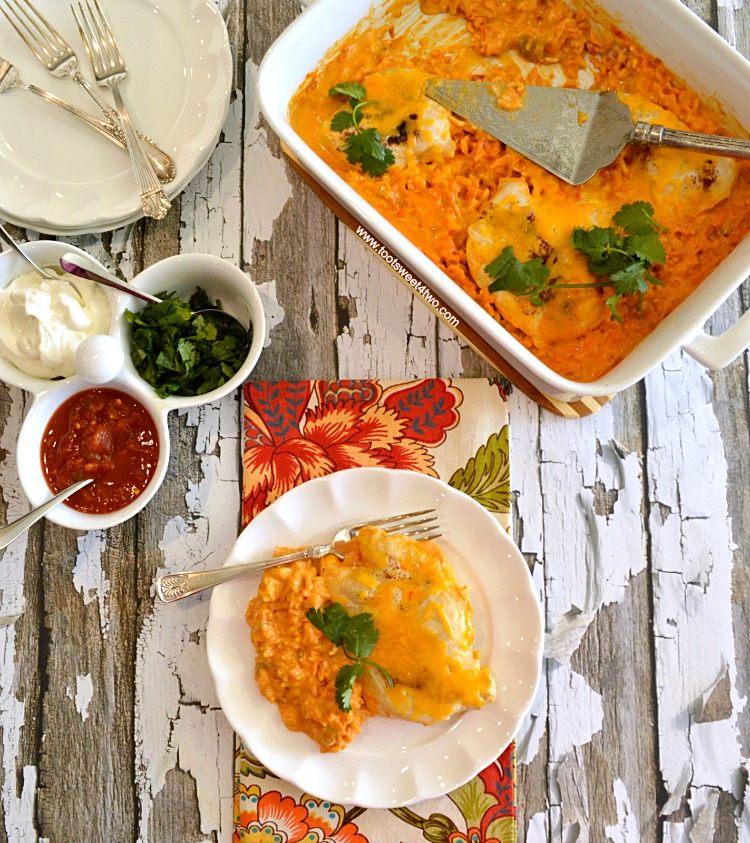 Cheesy Fiesta Salsa Chicken and Rice Bake is an easy and delicious dinner recipe for a busy night. Dump 7 simple ingredients in a casserole dish and bake! This easy prep casserole takes less than 10 minutes to assemble and dinner is service in under an hour! | www.tootsweet4two.com
