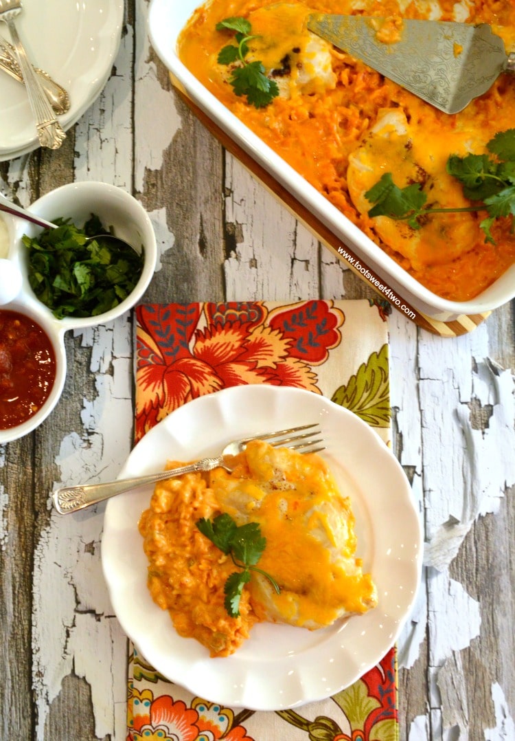 Cheesy Fiesta Salsa Chicken and Rice Bake is an easy and delicious dinner recipe for a busy night. Dump 7 simple ingredients in a casserole dish and bake! This easy prep casserole takes less than 10 minutes to assemble and dinner is served in under an hour! | www.tootsweet4two.com