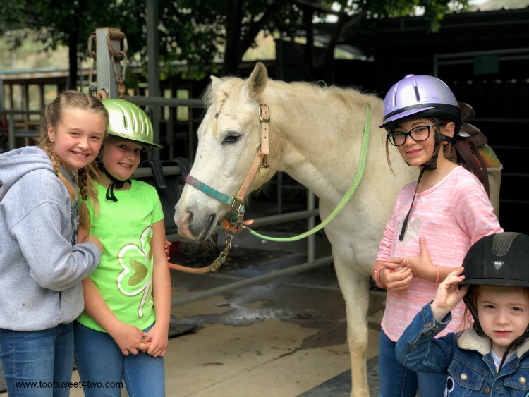 Payton, Parker, Hayden and Belle pose with Dandy the horse at The Ranch at Bandy Canyon