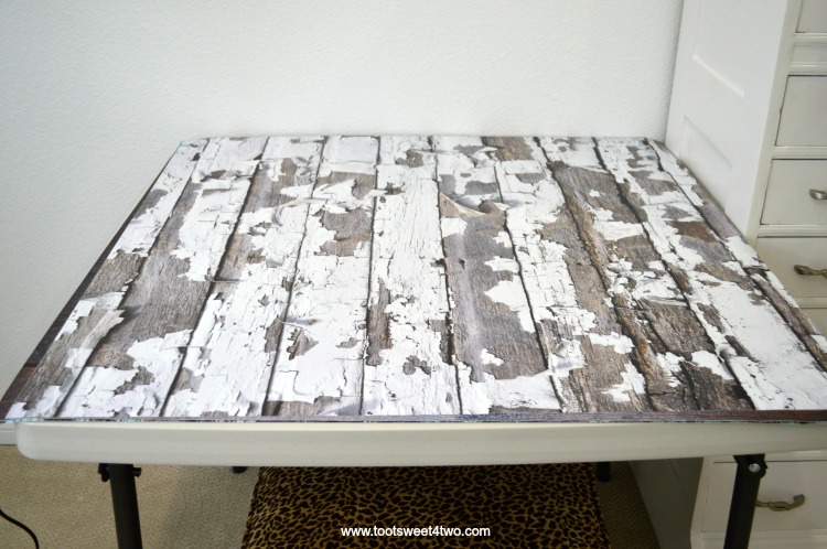 Faux white peeling paint wood photography backdrop on folding table