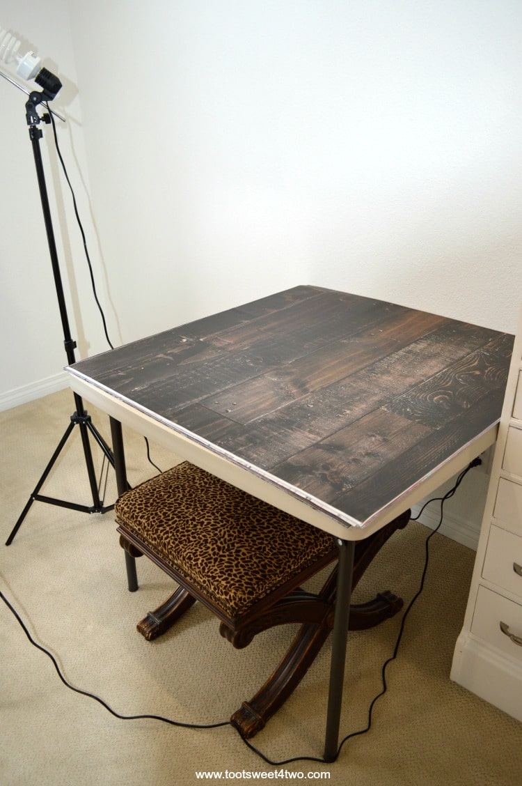 Faux wood photography backdrop on folding table